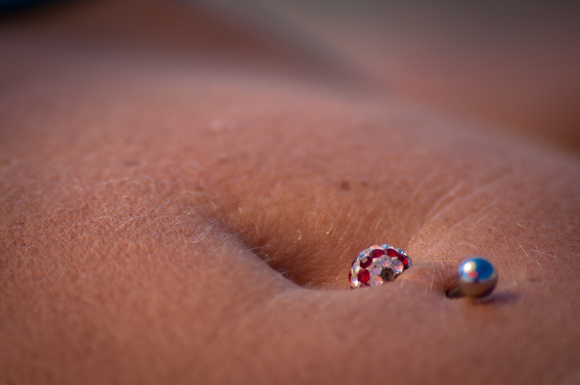 Piercing Imagen de un piercing en un ombligo