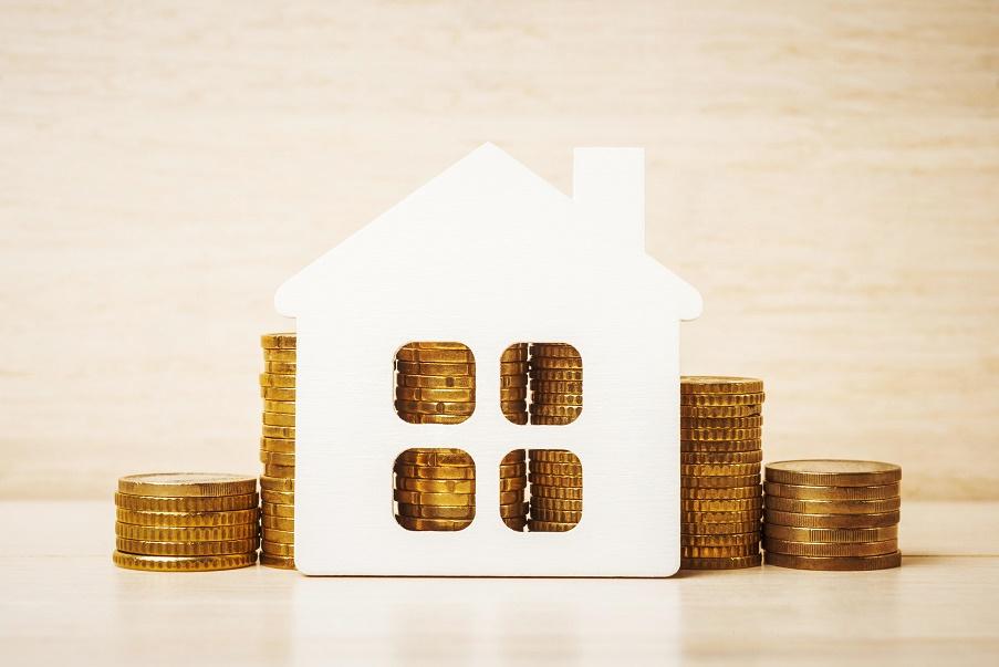 Casa con monedas Imagen de una casa con monedas