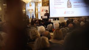 La presidenta durante el acto y el público asistente