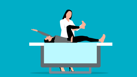 Icono de un paciente en una camilla asistido por un sanitario