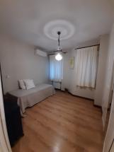 Bedroom with table and wardrobe