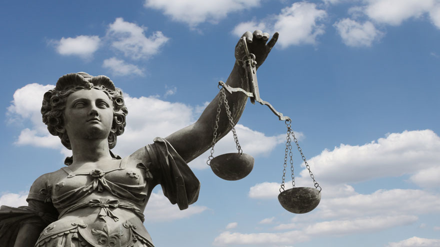 Statue of the goddess of Justice with a balance in her hand