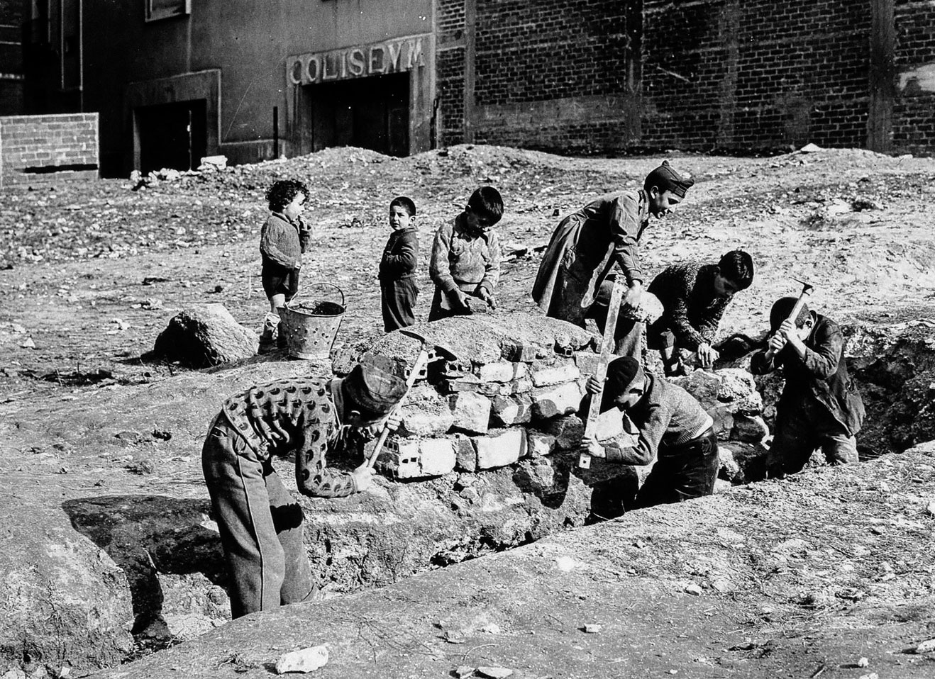 Group of children digging a ditch