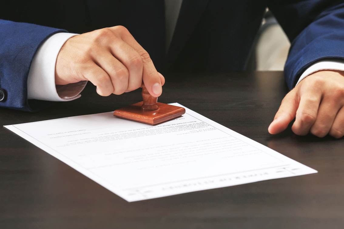 Person sealing a document