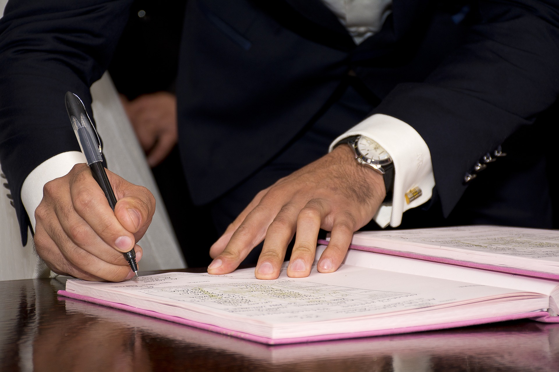 person signing a document