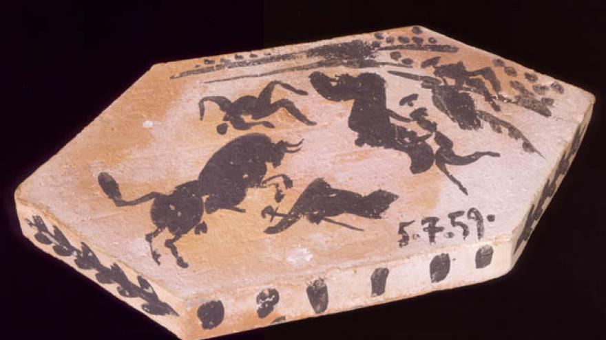 Ladrillo hexagonal con dibujo de toreros y toros en una corrida