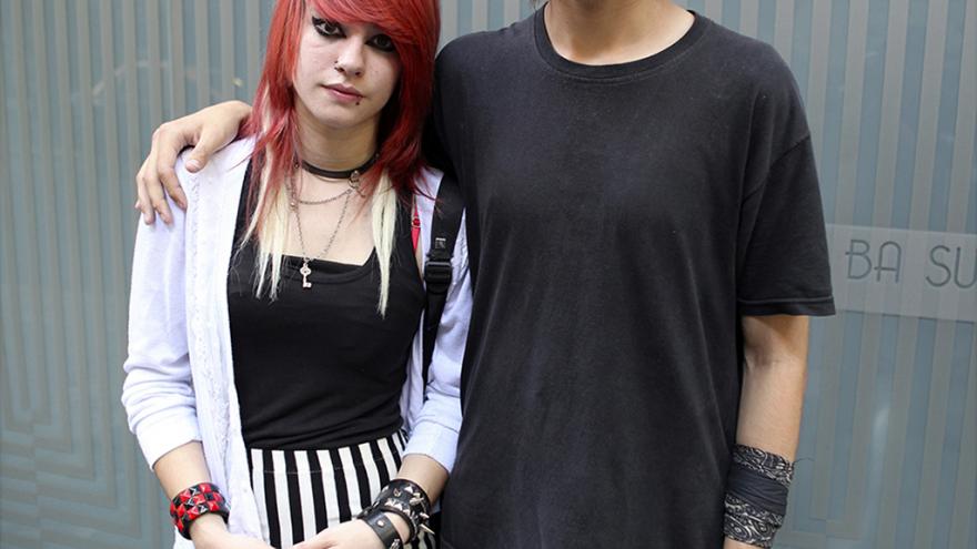 Young boy/girl dressed fashionably and posing in front of the camera
