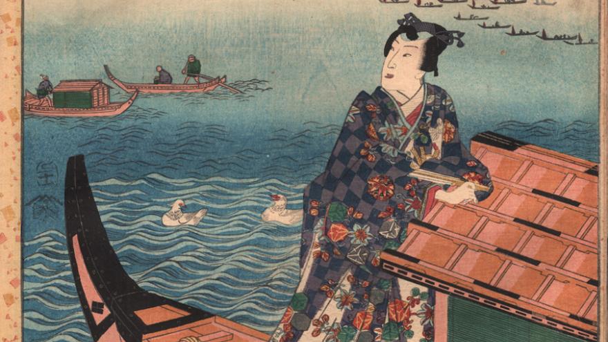 Japanese woman watches from a barge to other distant boats