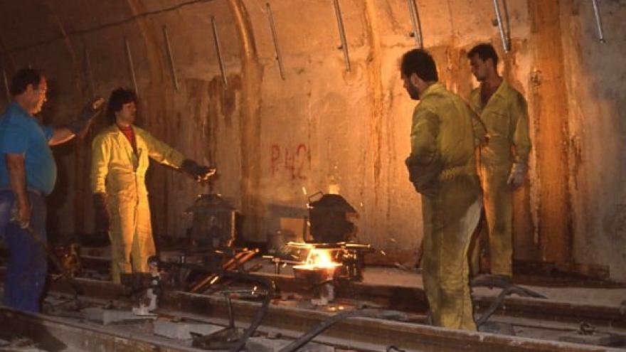 Workers working welding the track