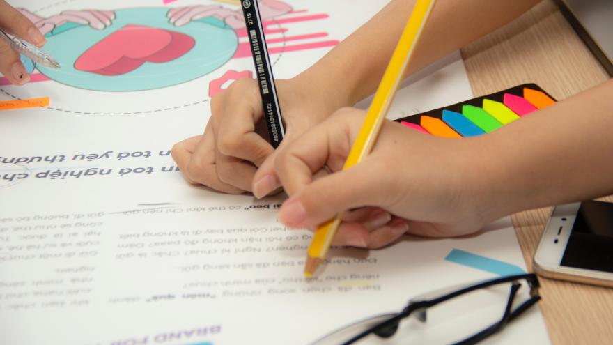 Children painting and school supplies