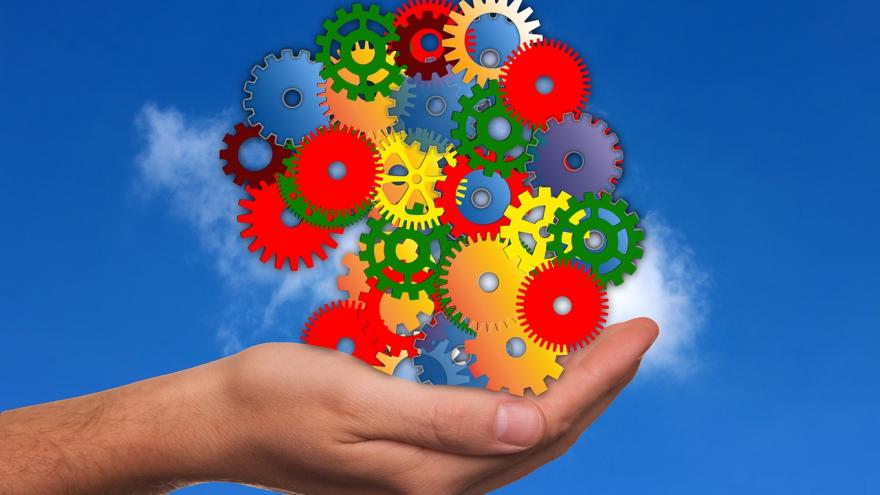 hand with colored gear