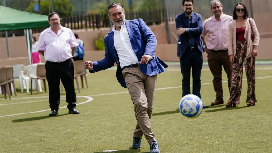 Enrique López hits a soccer ball