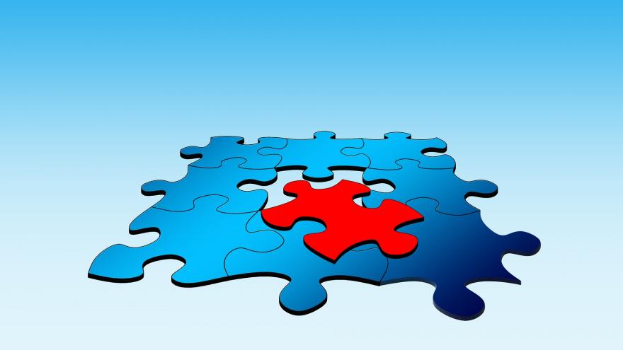 puzzle azul completo salvo por una ficha roja que está separada