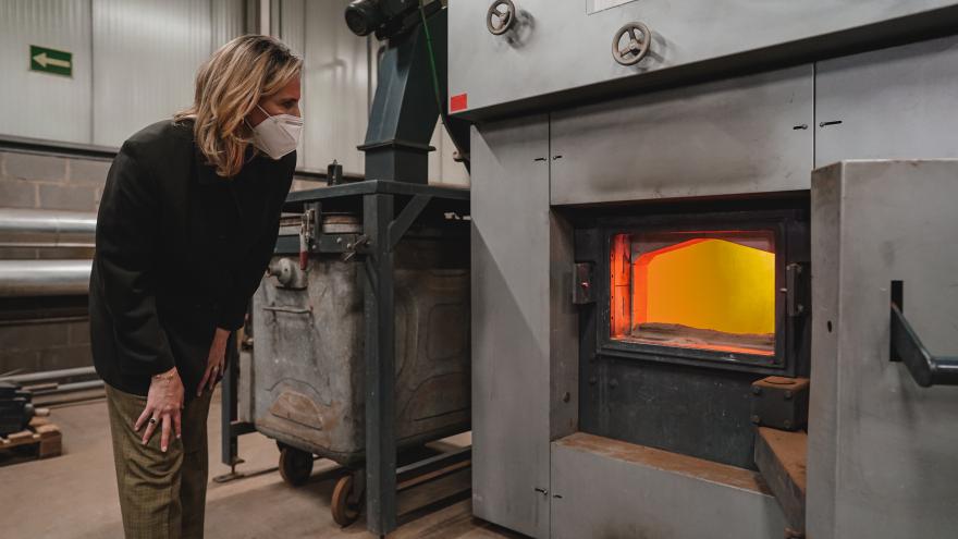 The counselor looking at a boiler