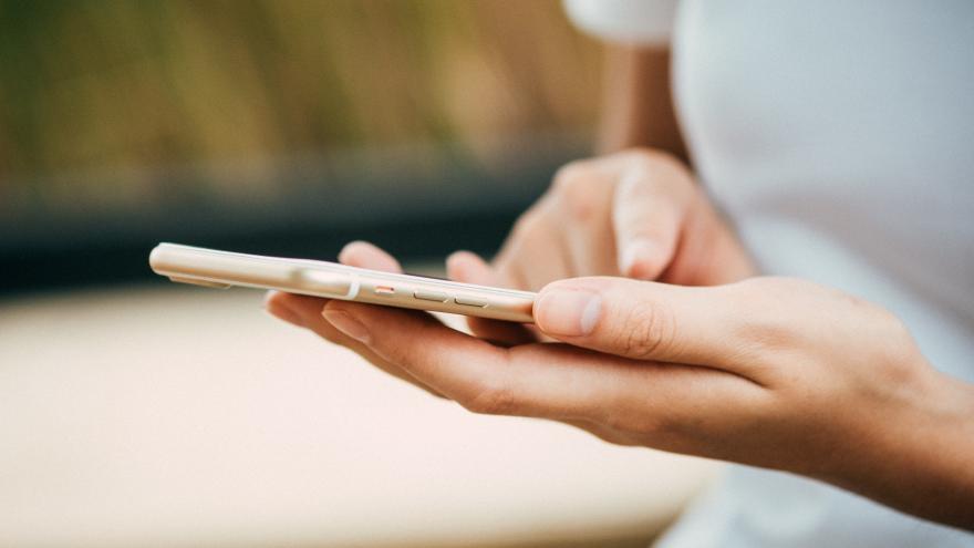 A person reading the mobile