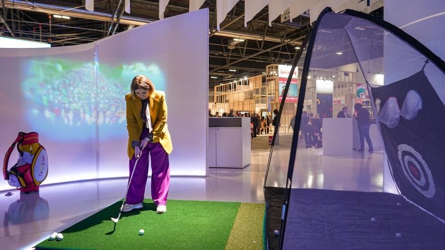 Counselor Marta Rivera with the golf club