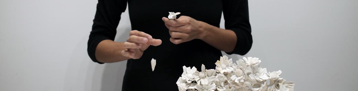 Performance of a woman stripping daisies