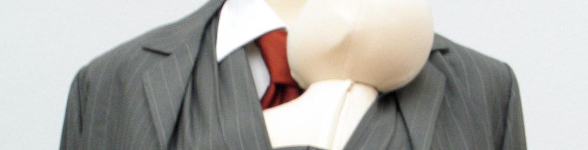 Mannequin with a man's suit transformed in such a way that he can carry a baby in his vest