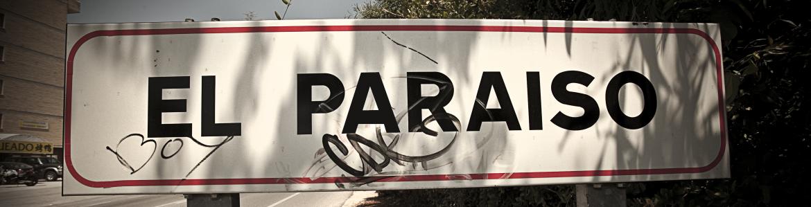 Road sign that reads EL PARADISE