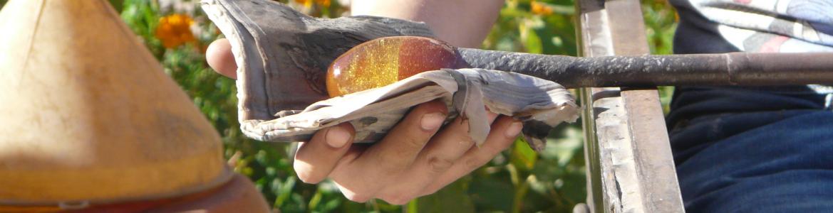 Hand handling glass in an outdoor display