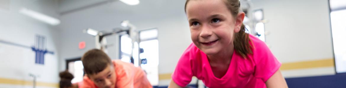 Children doing gymnastics at school
