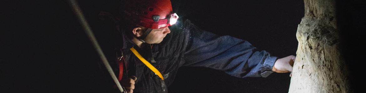 man practicing caving