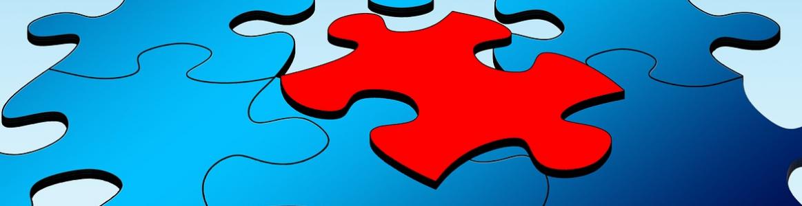 Imagen de puzle azul con ficha sobresaliente en rojo