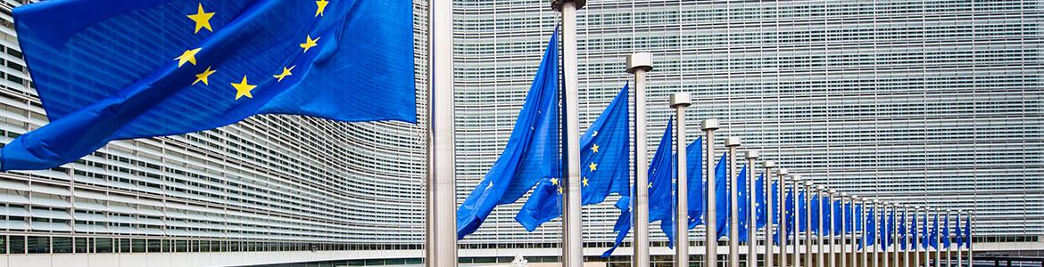 EU flags flying in front of the Berlaymont building