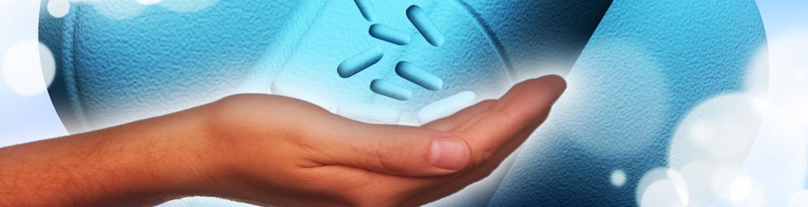 hand with medicine and blue background