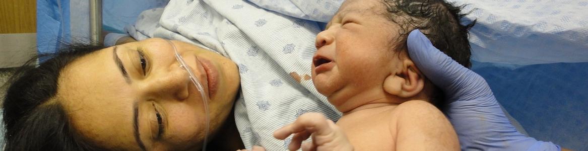 image of woman with baby after childbirth