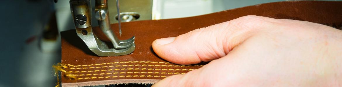 Image of a leather worker working in the workshop