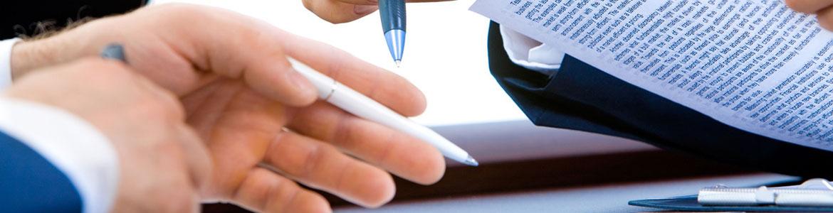 People signing an agreement
