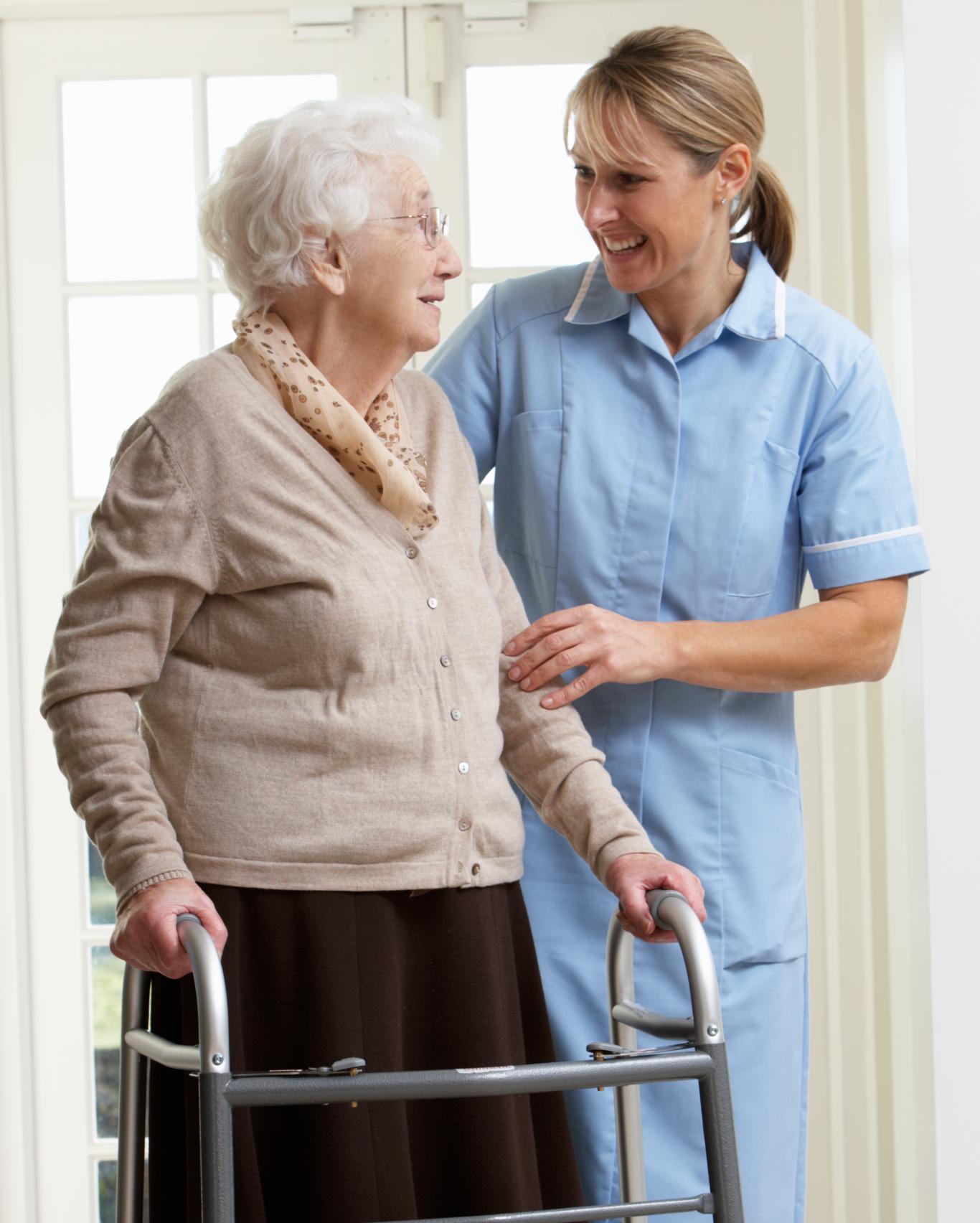Senior Woman Standing With Nurse