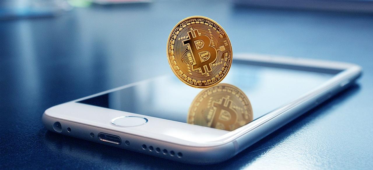 Golden coin on a mobile phone