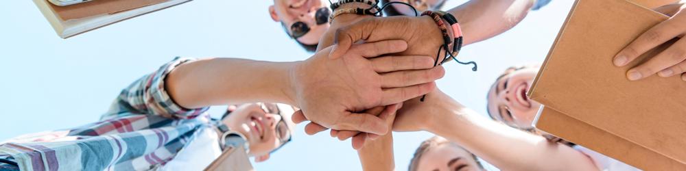 hands of young people united